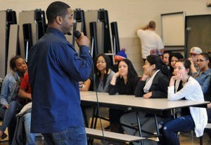 Male speaker talking to students